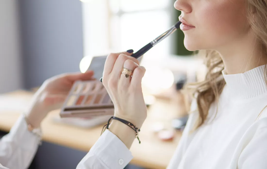 beautiful-young-model-woman-getting-fashion-makeup